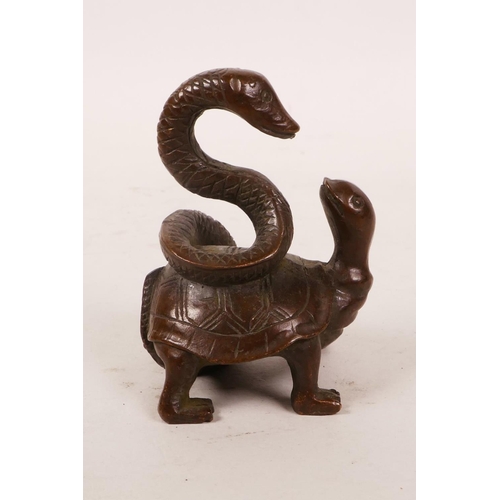 15 - An Oriental bronze of a tortoise with a snake, 2½