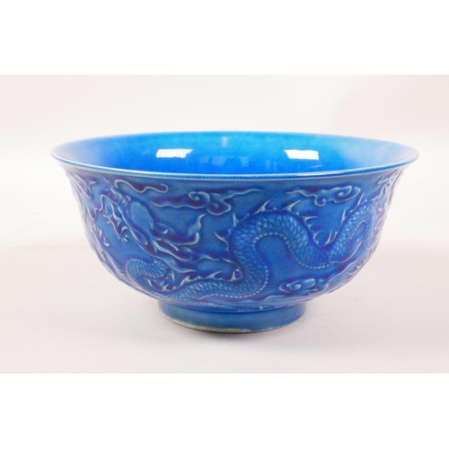 3 - A Chinese blue glazed porcelain rice bowl with underglaze dragon decoration, 6 character mark to bas... 