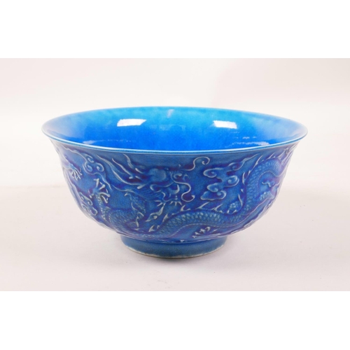 3 - A Chinese blue glazed porcelain rice bowl with underglaze dragon decoration, 6 character mark to bas... 