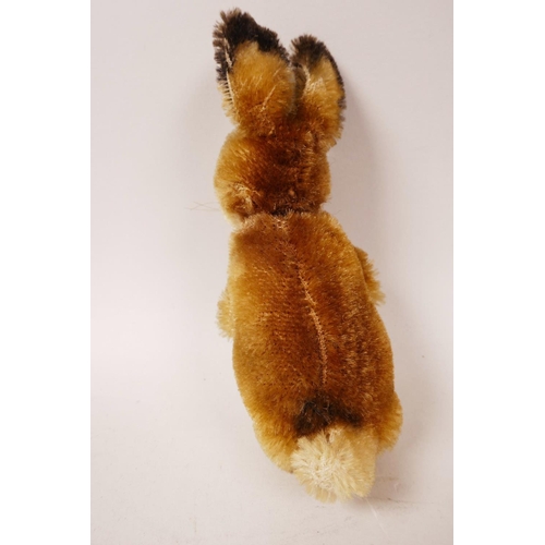 34 - A 1952/53 Steiff begging rabbit, golden mohair, fixed limbs, brown and black glass eyes, red stitchi... 