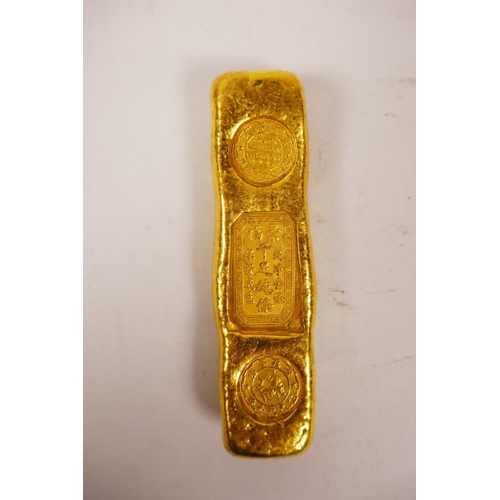 40 - A Chinese gilt white metal trade token/ingot, 4