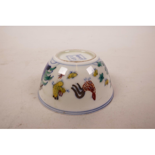 46 - A Chinese doucai porcelain tea bowl with chicken decoration, 6 character mark to base, 3½