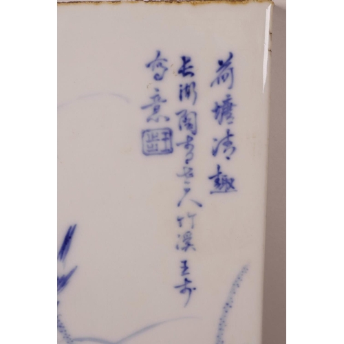 51 - A Chinese blue and white porcelain plaque decorated with a bird and lotus flower, 9½