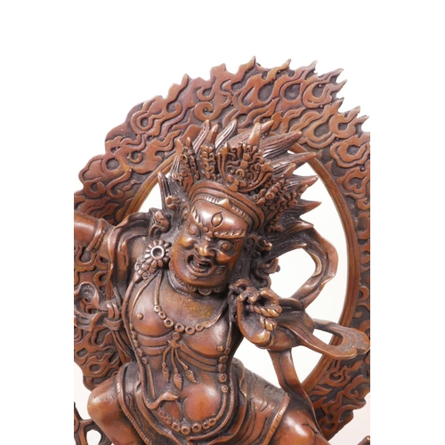 55 - A Sino-Tibetan coppered metal figure of a wrathful deity, impressed double vajra mark to base, 7½