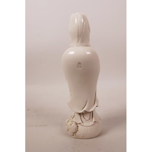 60 - A Chinese blanc de chine figure of Quan Yin, impressed mark verso, 9½