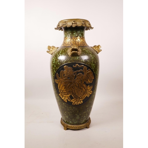 61 - A large Chinese mottled green glazed pottery vase with ormolu style mounts and lion mask handles, th... 