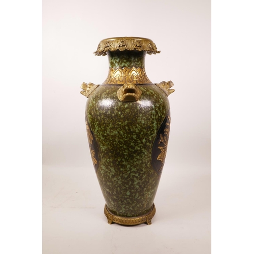 61 - A large Chinese mottled green glazed pottery vase with ormolu style mounts and lion mask handles, th... 