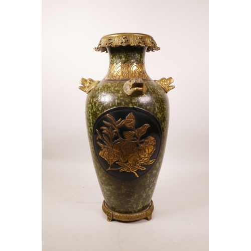 61 - A large Chinese mottled green glazed pottery vase with ormolu style mounts and lion mask handles, th... 