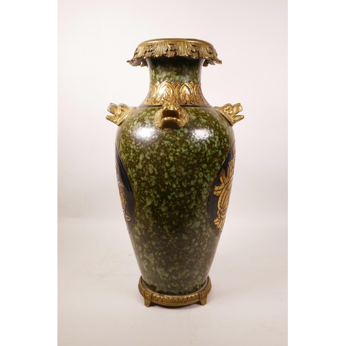 61 - A large Chinese mottled green glazed pottery vase with ormolu style mounts and lion mask handles, th... 