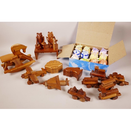 62 - A quantity of animated wooden toys, two puzzle trinket boxes and a box of painted eggs with surprise... 