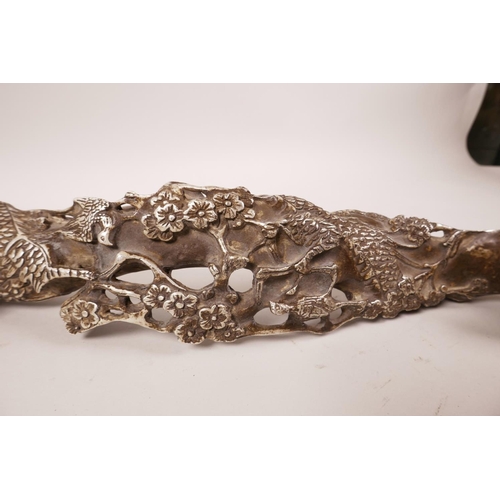 63 - A large Chinese silvered metal ruyi with dragon decoration, 17