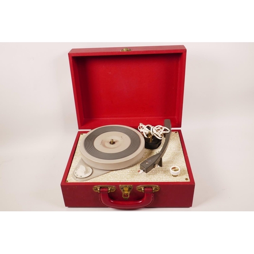 71 - A Vintage (1960s) suitcase portable record player, 12½