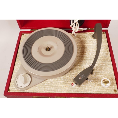 71 - A Vintage (1960s) suitcase portable record player, 12½