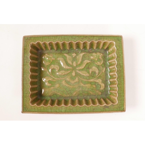 8 - A Chinese green glazed pottery trinket dish with a ribbed interior and raised lotus flower decoratio... 