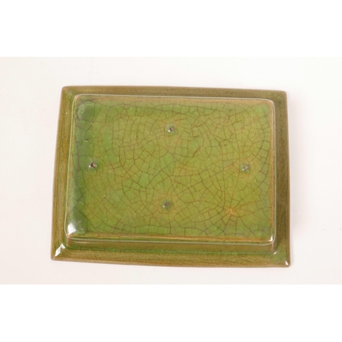 8 - A Chinese green glazed pottery trinket dish with a ribbed interior and raised lotus flower decoratio... 