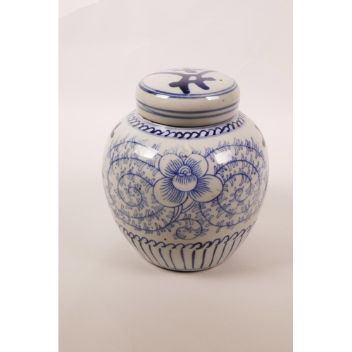 15 - A Chinese blue and white porcelain ginger jar and cover decorated with scrolling floral pattern and ... 