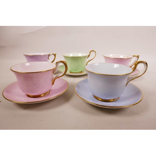 19 - A 1930s Paragon China part tea set, sponged pastel colours of pink, lilac, green and blue, with gilt... 