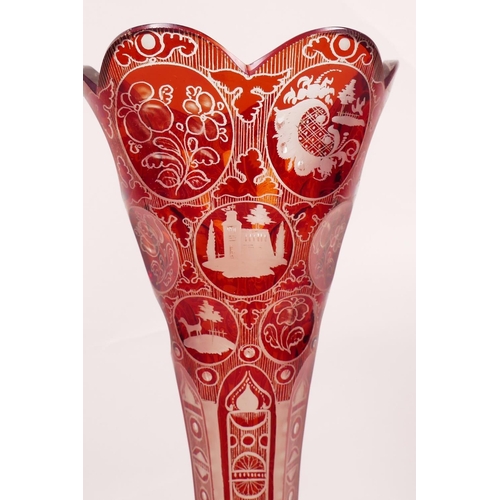 22 - A Bohemian red overlay and etched glass trumpet vase, 10½