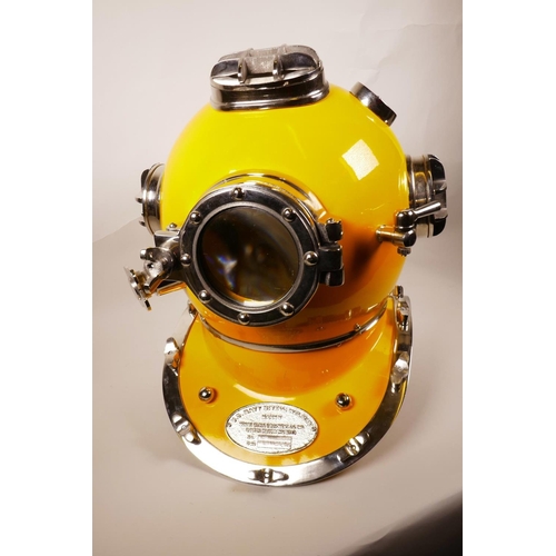 29 - A replica chrome and yellow enamelled USA diver's helmet, 17