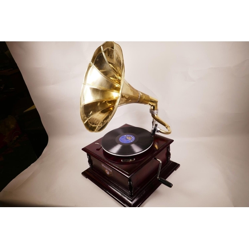 42 - A replica Victorola wind up horn gramophone with mahogany case and brass horn, 14½