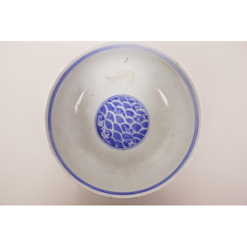 5 - A Chinese blue and white porcelain bowl decorated with a dragon chasing the flaming pearl, 6 charact... 