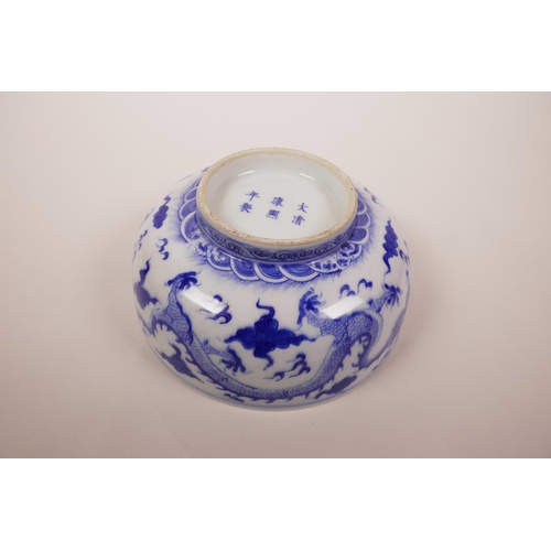 5 - A Chinese blue and white porcelain bowl decorated with a dragon chasing the flaming pearl, 6 charact... 