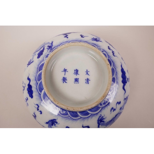 5 - A Chinese blue and white porcelain bowl decorated with a dragon chasing the flaming pearl, 6 charact... 