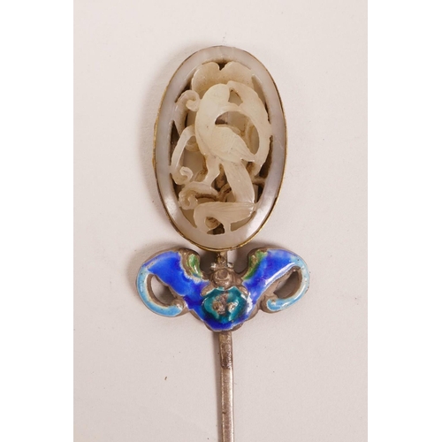 55 - A Chinese white metal hair pin with enamelled bat decoration, set with a jade carving to end, 5½