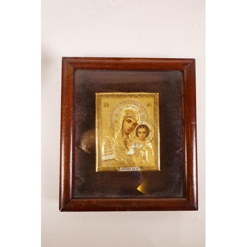 57 - A collection of ten religious artefacts, including six Madonna and Child icons, three of Christ on t... 