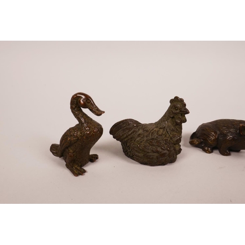 58 - Four Chinese bronzed metal animals including two ducks, a chicken and a boar, largest 2