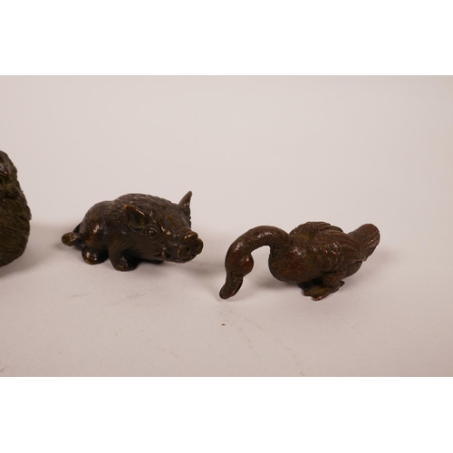 58 - Four Chinese bronzed metal animals including two ducks, a chicken and a boar, largest 2