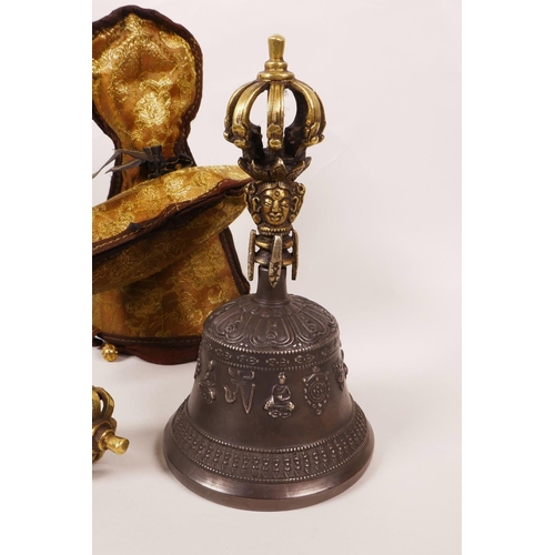 60 - A Sino-Tibetan bell with a brass handle in the form of a vajra, together with a brass ceremonial vaj... 