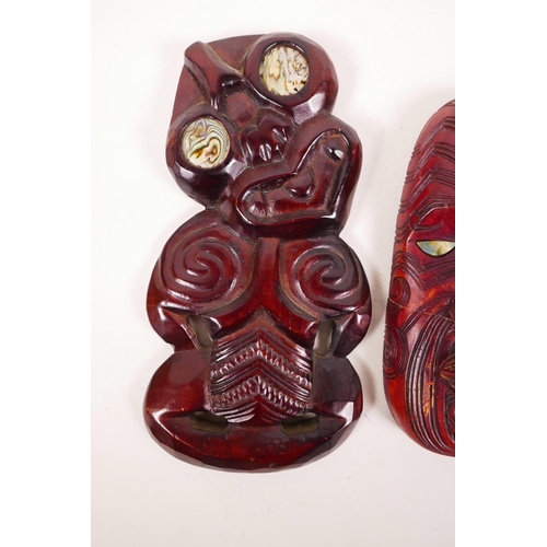 61 - A Maori carved wood Hei-Tiki figure with abalone set eyes, together with a similar Maori mask (A/F),... 