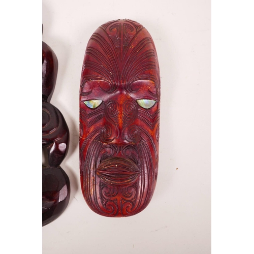 61 - A Maori carved wood Hei-Tiki figure with abalone set eyes, together with a similar Maori mask (A/F),... 