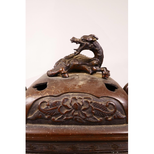 64 - A large Meiji Japanese koro in bronze, decorated with dragons, flowers and various figures, finely c... 