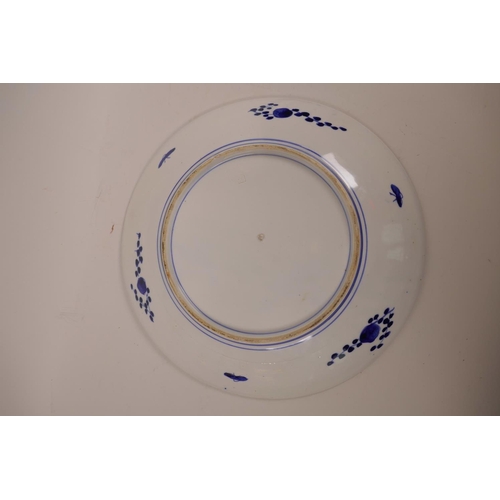 25 - An Oriental blue and white decorative plate, with red seal imprinted to base, 12