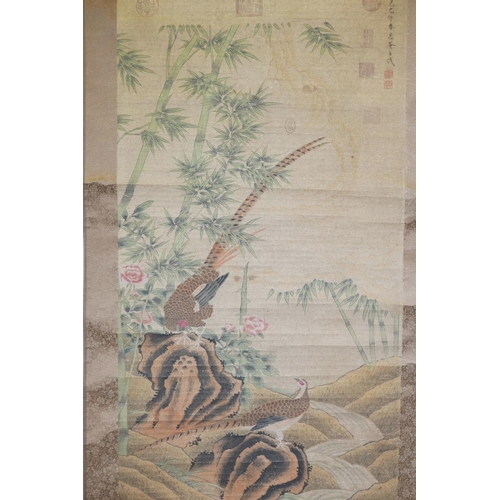 28 - A Chinese watercolour scroll decorated with two pheasants in a landscape, 26