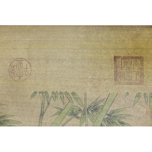 28 - A Chinese watercolour scroll decorated with two pheasants in a landscape, 26