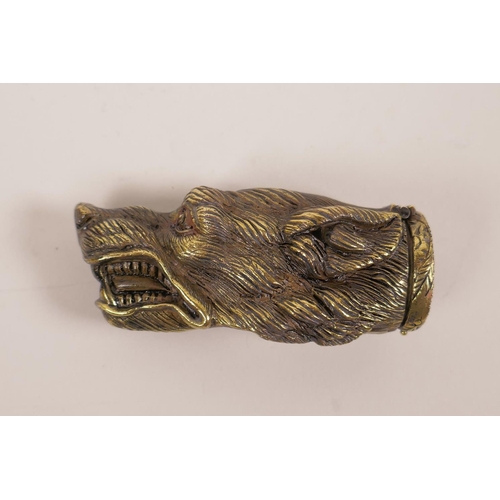 29 - A brass vesta case shaped as the head of a snarling dog, 13