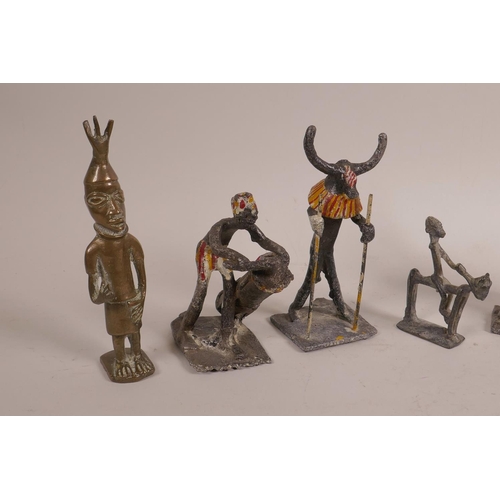 30 - An African Benin brass figure of a hunter, together with another small Benin bronze of a figure on h... 