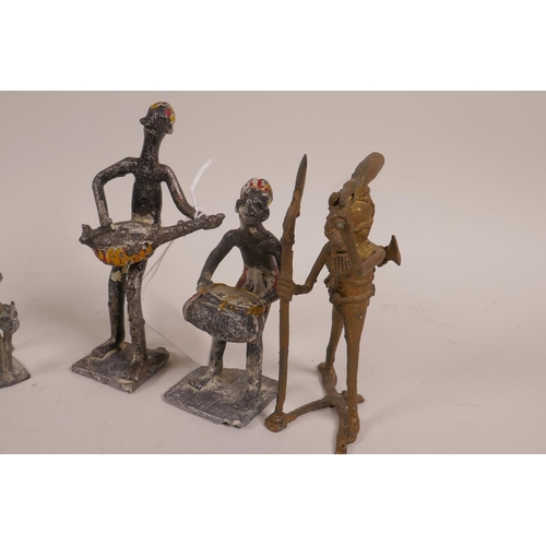 30 - An African Benin brass figure of a hunter, together with another small Benin bronze of a figure on h... 