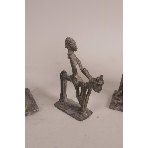 30 - An African Benin brass figure of a hunter, together with another small Benin bronze of a figure on h... 