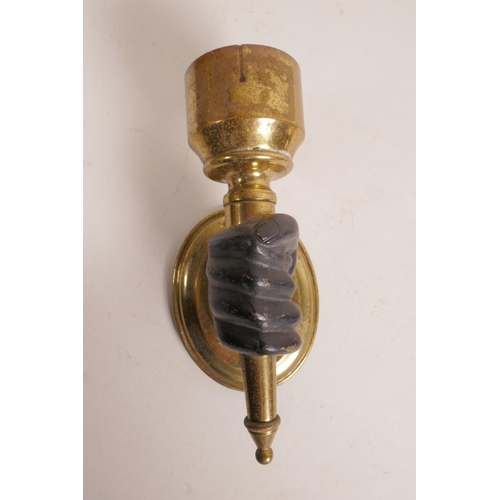 39 - A pair of brass wall lights, with bronze hands clasping the torcheres, 6