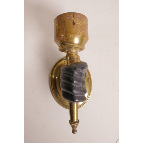 39 - A pair of brass wall lights, with bronze hands clasping the torcheres, 6