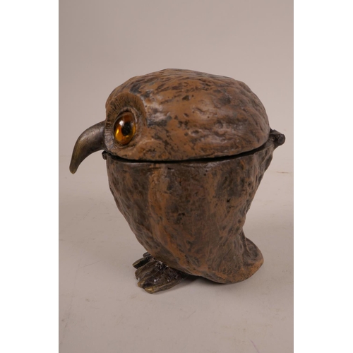 51 - A cold painted bronze owl inkwell, with glass eyes and  hinged head, in the style of Bergman, signed... 