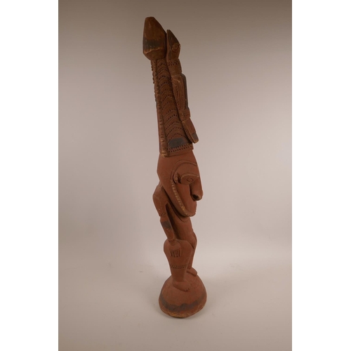 53 - A carved wood New Guinea Sepik tribal figure, 25