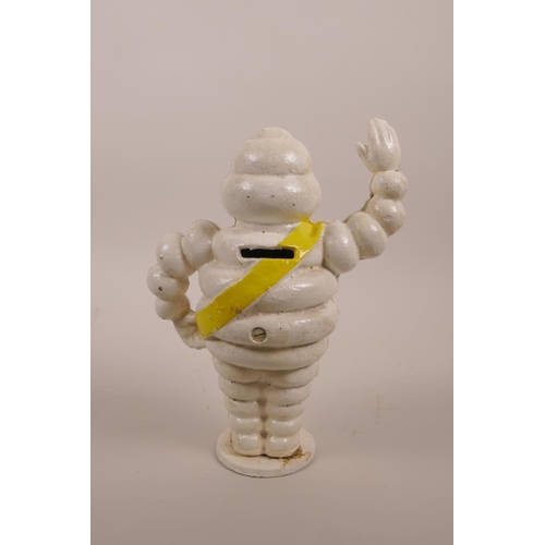 55 - A painted cast iron novelty money box in the form of a Michelin Man, 8½