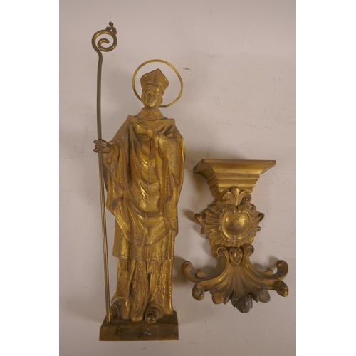 59 - A gilt bronze figure of a cardinal, mounted on a bracket,  18