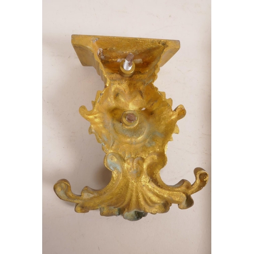 59 - A gilt bronze figure of a cardinal, mounted on a bracket,  18