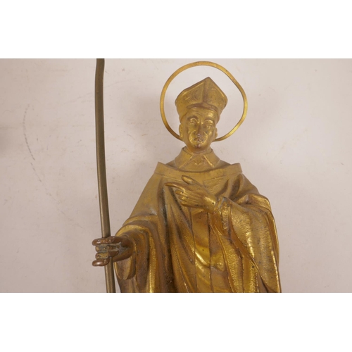 59 - A gilt bronze figure of a cardinal, mounted on a bracket,  18